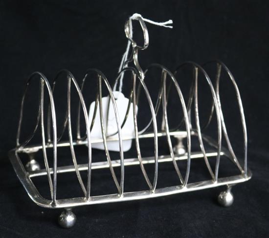 A George III silver seven bar toast rack by Thomas Lamborn, 7.5 oz.